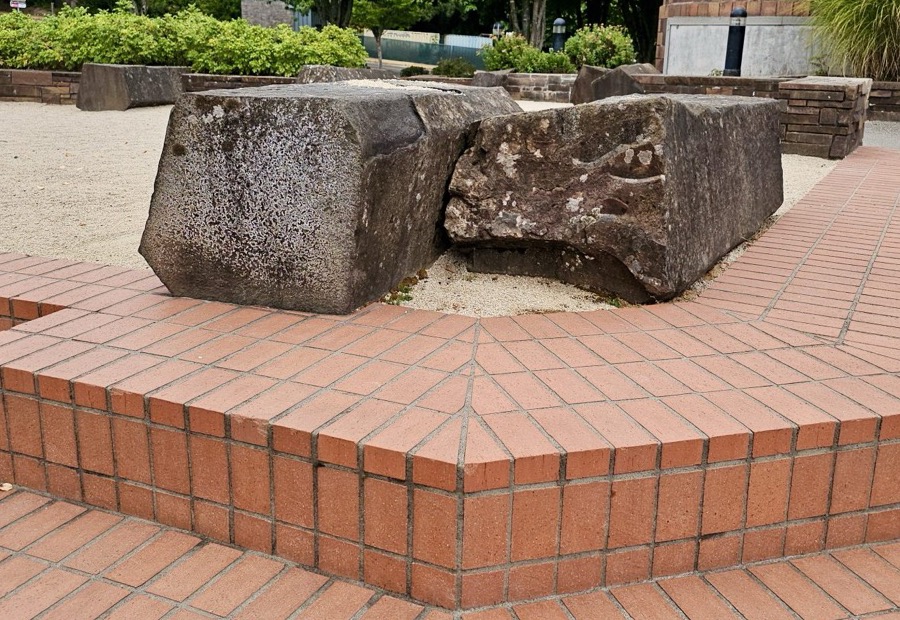 Brick front steps with a loose tread and open joints